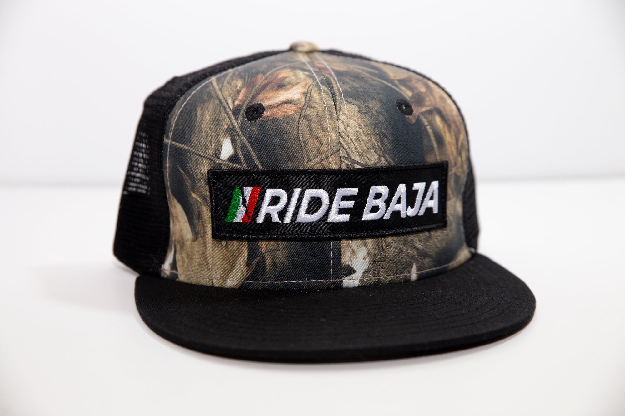 "Ride Baja Mexican Insurance" Rider Hat with Flag. - Hybricam Camo/Black